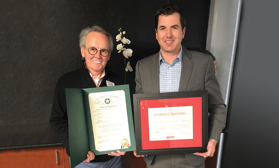 CCMH Leadership with certificates of appreciation from Lawton Chamber & State Representatives