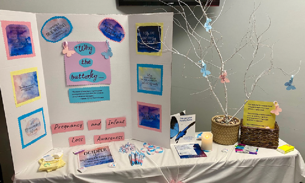 pregnancy and infant loss display with paper butterflies on a tree