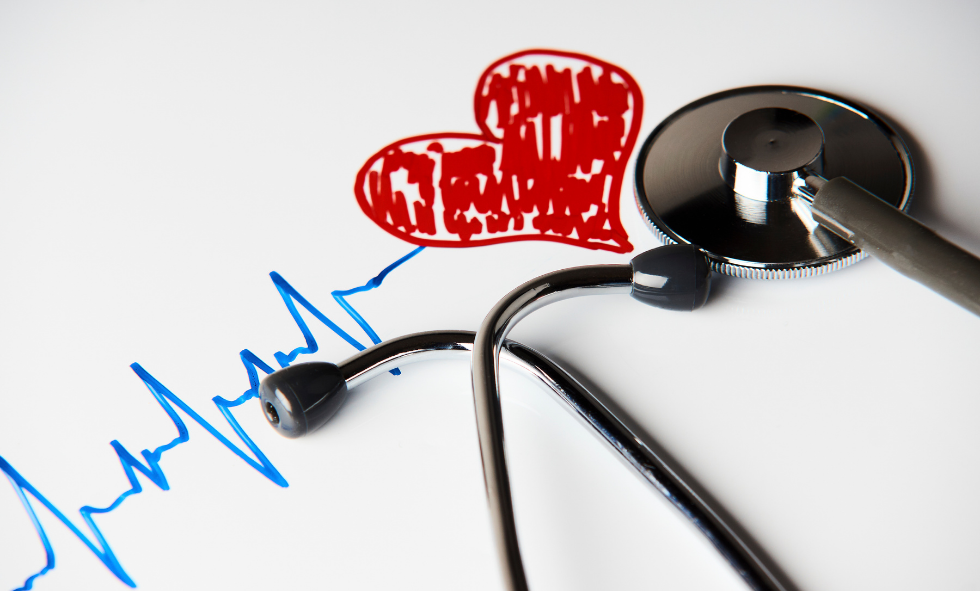 holiday heart graphic with stethoscope and red heart drawn on paper with blue heart beat