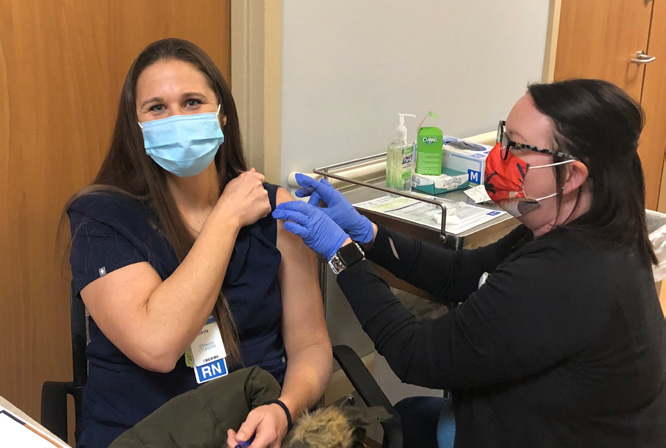 CCMH employee being given new COVID vaccine