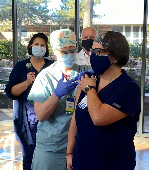 CCMH employee being given new COVID vaccine
