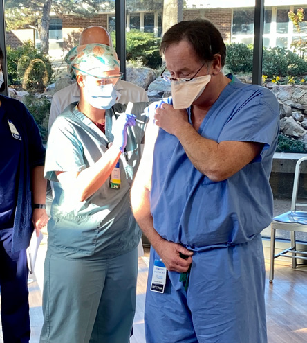 CCMH employee being given new COVID vaccine