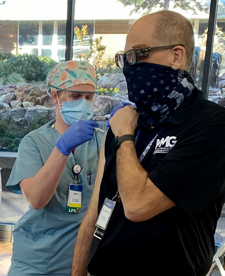 CCMH employee being given new COVID vaccine