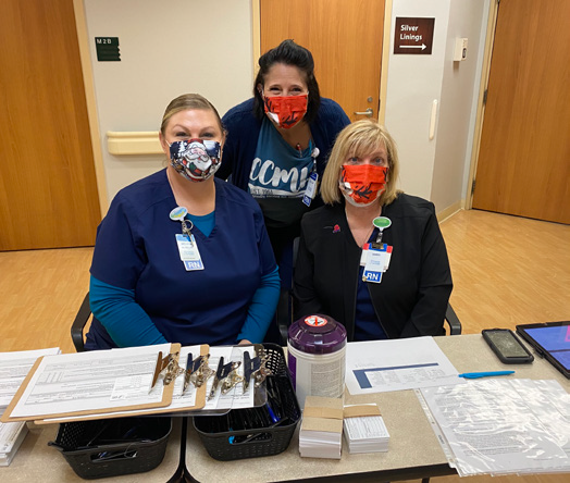 COVID vaccinated CCMH employees posing for picture