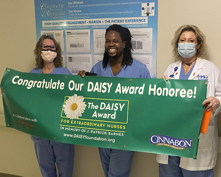 Liz Roloff and Teresa Fletcher with Quinton Anderson, RN