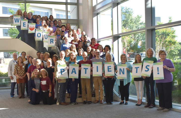 CCMH employees with signs