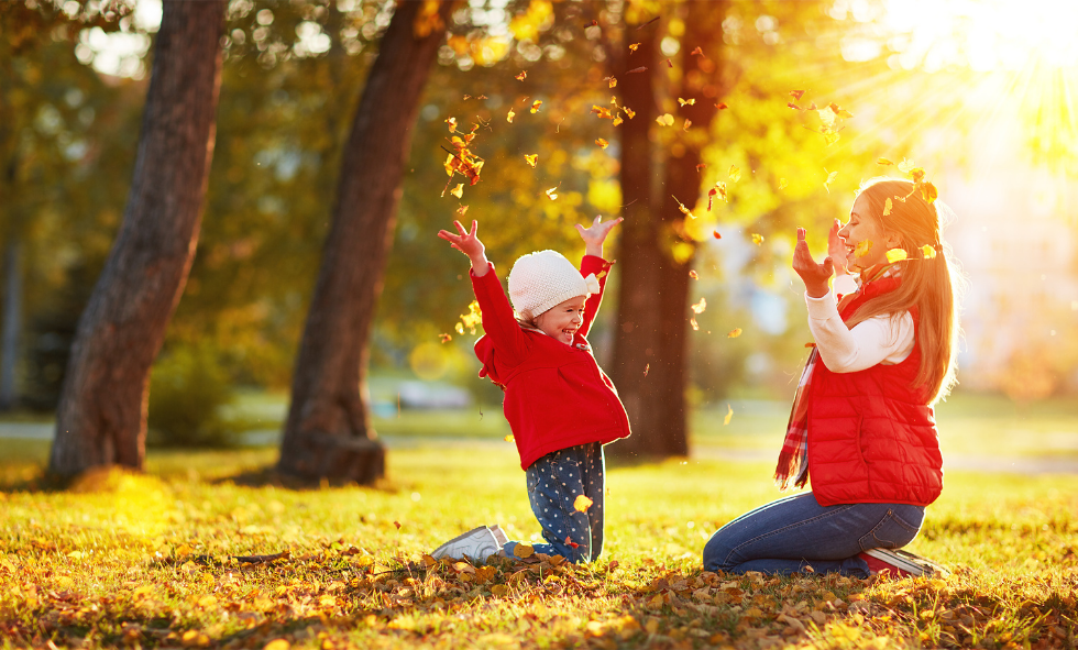 Children playing in leaves