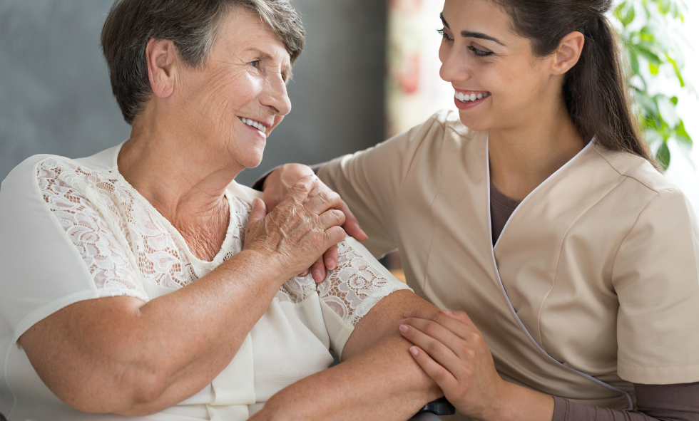 osteoporosis bone health women osteoporosis woman with nurse in tan scrubs