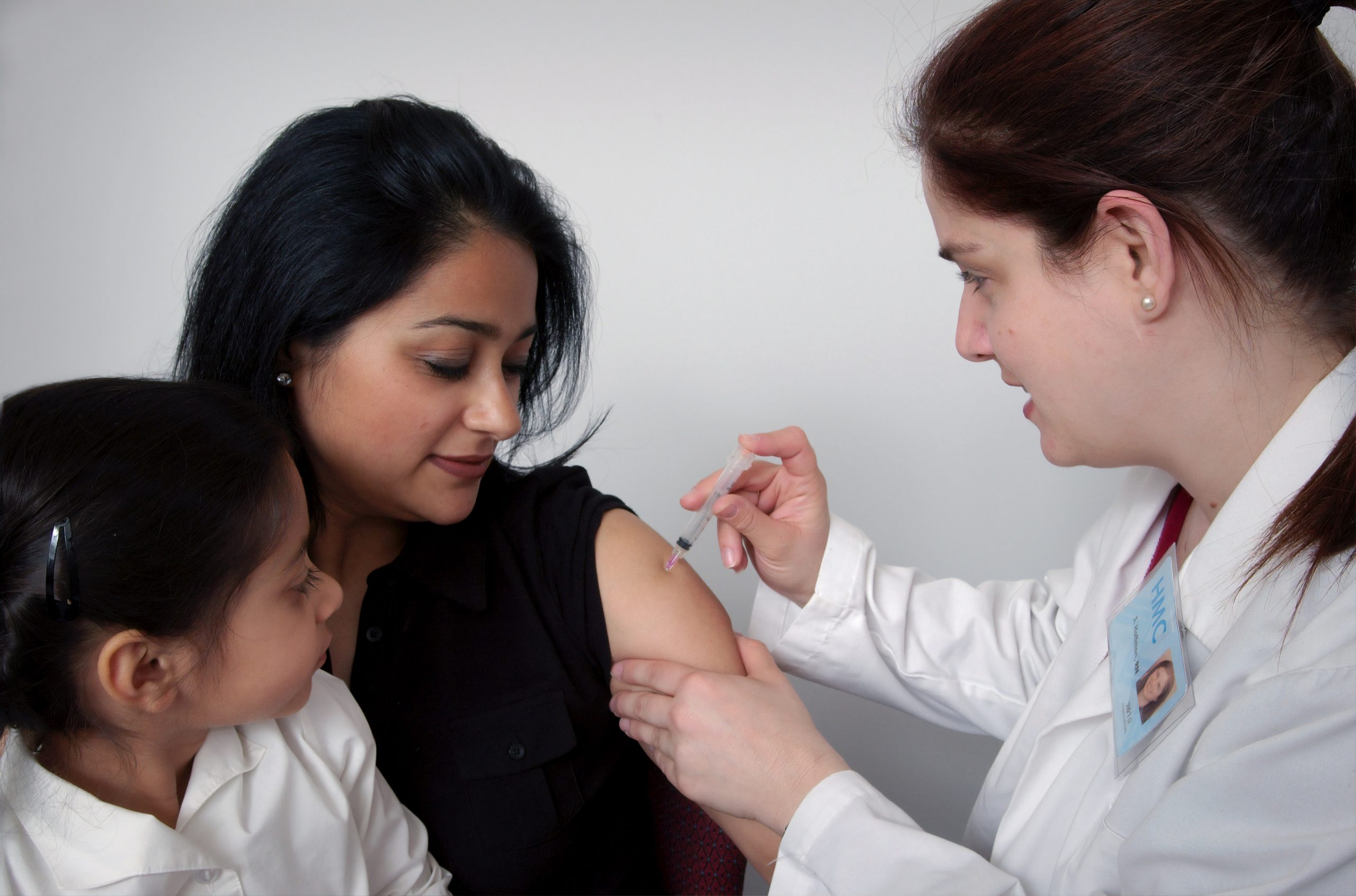 Mother and daughter getting immunizations together
