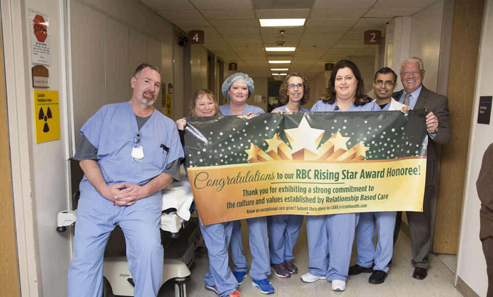 risingstar_jennifer CCMH team members holding banner