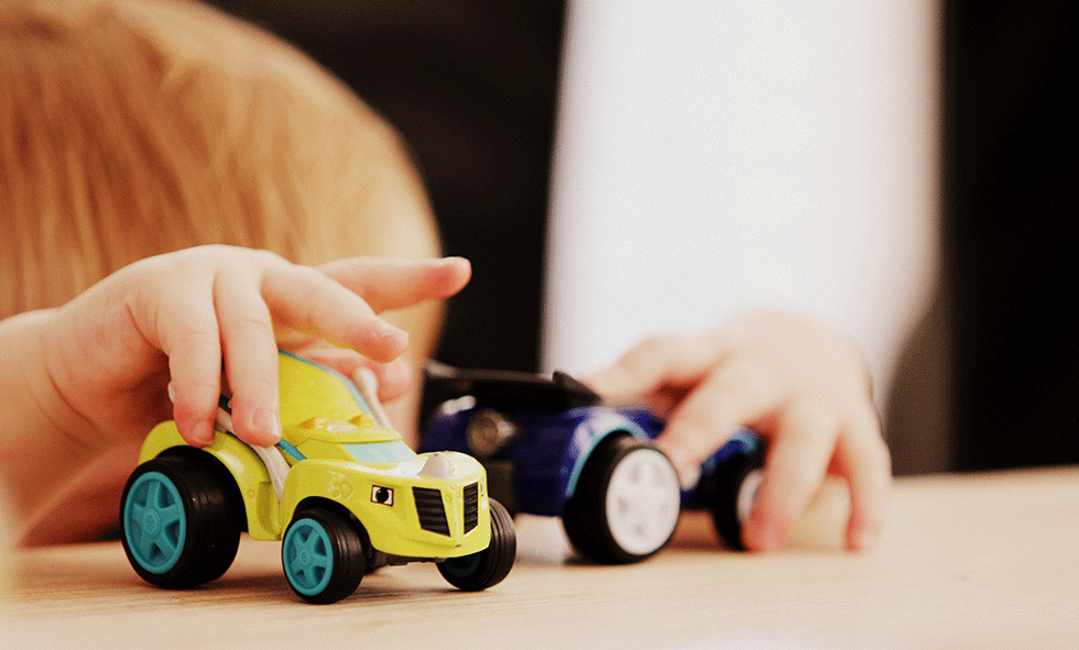 boy playing with toys